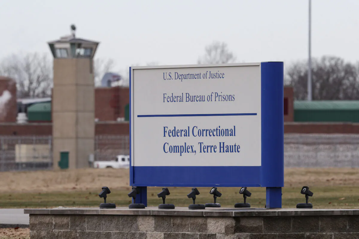 The guard tower flanks the sign at the entrance to the U.S. Penitentiary in Terre Haute, Ind., on Dec. 10, 2019. (Michael Conroy/AP Photo)