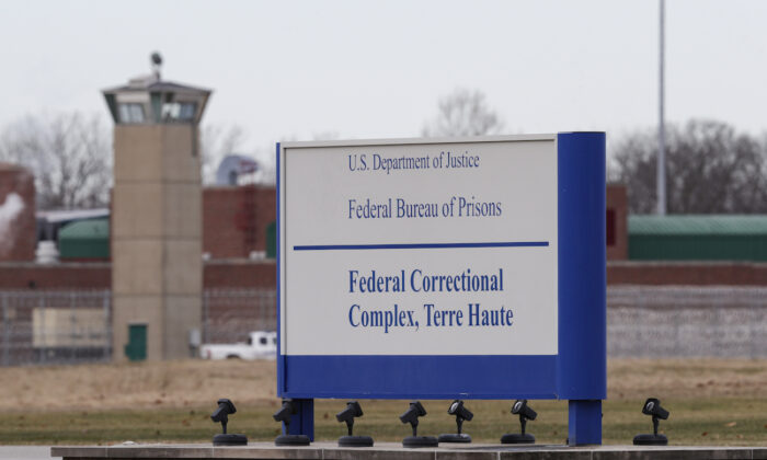 The guard tower flanks the sign at the entrance to the U.S. Penitentiary in Terre Haute, Ind., on Dec. 10, 2019. (Michael Conroy/AP Photo)