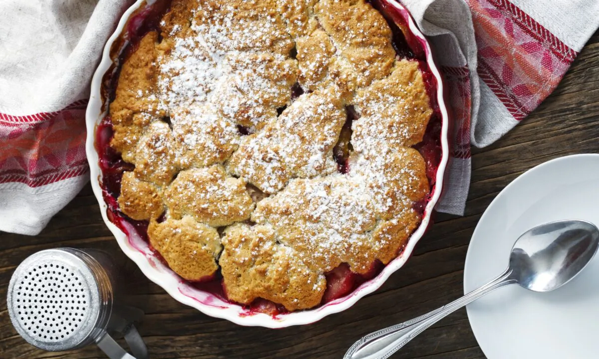 A second type of cobbler is made by topping a layer of syrupy fruit with dollops of sweet biscuit or shortbread dough. (AnjelikaGr/Shutterstock)