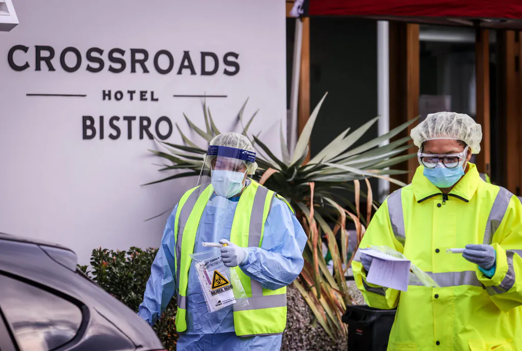 Medical staff at a pop-up COVID-19 testing clinic, perform tests on drivers in the Sydney suburb of Casula, Australia on July 11, 2020. (David Gray/Getty Images)