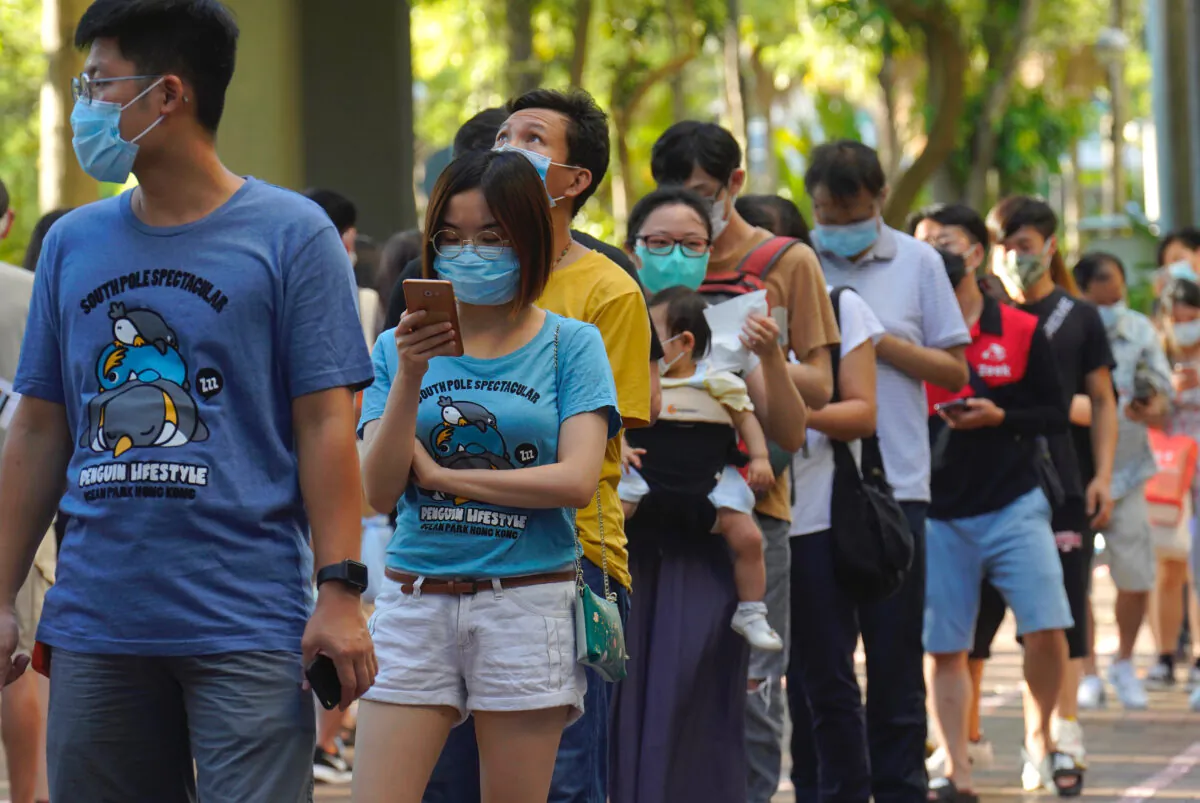 People queue up to vote in Hong Kong, on July 12, 2020,  (Vincent Yu/AP Photo)