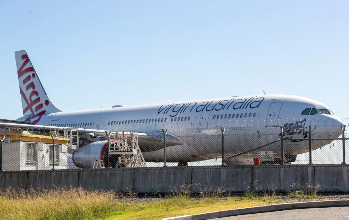 Virgin planes are seen parked on a tarmac at Brisbane Airport in Brisbane, Australia on April 21, 2020. (Jono Searle/Getty Images)