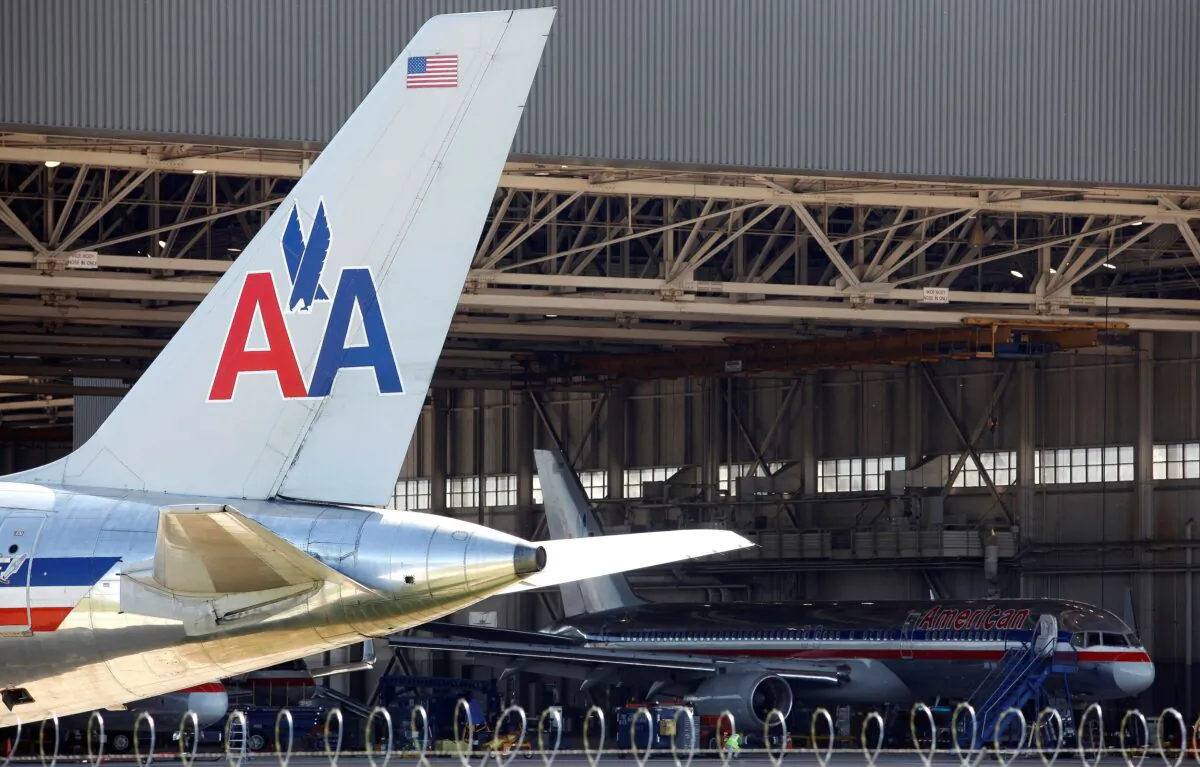 An American Airlines airliner sits near a hanger at Dallas/Fort Worth International Airport, Texas, on April 4, 2012. (Tim Sharp/Reuters)