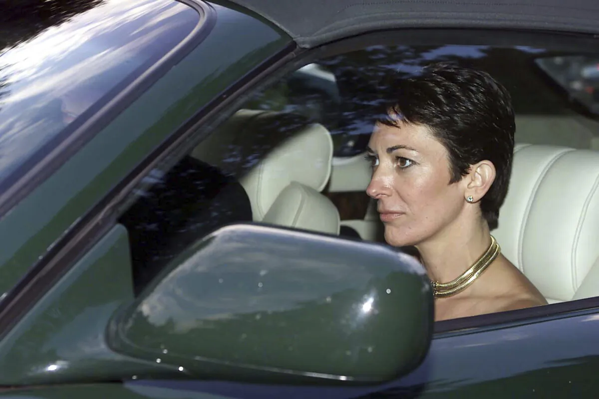 British socialite Ghislaine Maxwell, driven by Britain's Prince Andrew leaves the wedding of a former girlfriend of the prince, Aurelia Cecil, at the Parish Church of St Michael in Compton Chamberlayne near Salisbury, England, on Sept. 2, 2000. (Chris Ison/PA via AP)