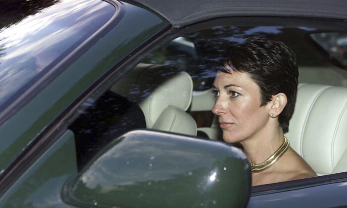 British socialite Ghislaine Maxwell, driven by Britain's Prince Andrew leaves the wedding of a former girlfriend of the prince, Aurelia Cecil, at the Parish Church of St Michael in Compton Chamberlayne near Salisbury, England, on Sept. 2, 2000. (Chris Ison/PA via AP)