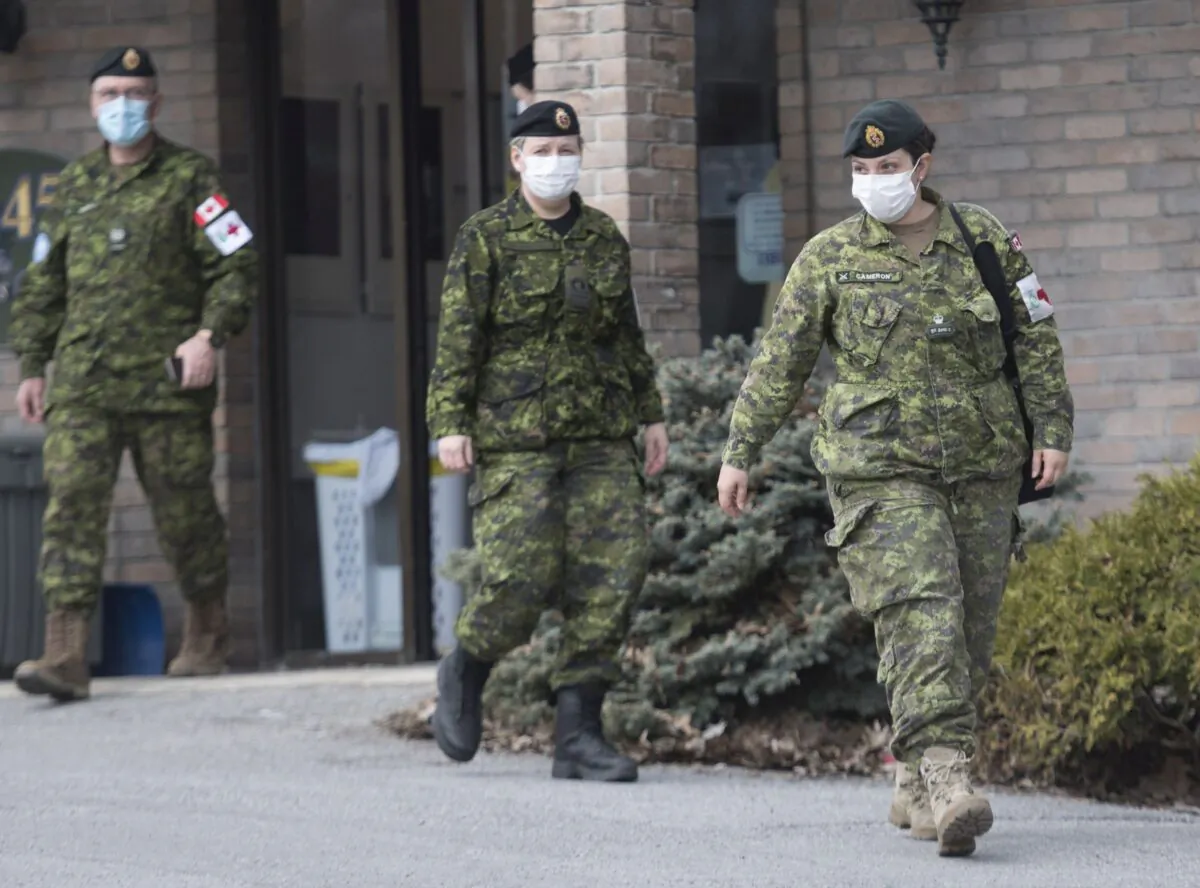 Members of the Canadian Armed Forces outside Residence Villa Val des Arbres in Laval, Que., on April 19, 2020. A mix of regular and reserve forces helped out in long-term care facilities in Quebec at the height of the pandemic. (The Canadian Press/Graham Hughes)