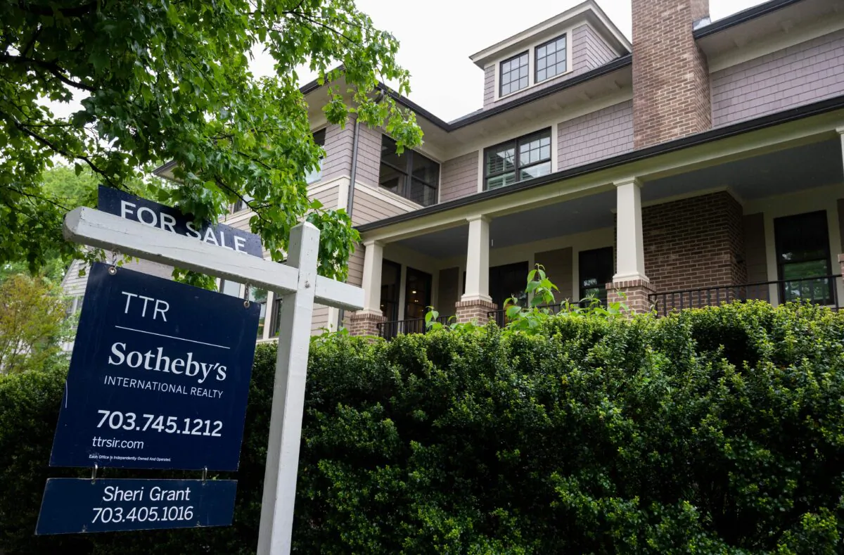 A for sale sign is seen next to a house in Arlington, Virginia on May 6, 2020. (Andrew Caballero-Reynolds/AFP via Getty Images)