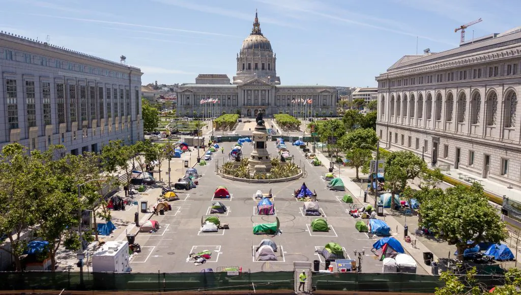 An aerial view shows squares painted on the ground to encourage homeless people to keep to social distancing at a city-sanctioned homeless encampment across from City Hall in San Francisco, Calif., on May 22, 2020. (Josh Edelson/AFP/Getty Images)