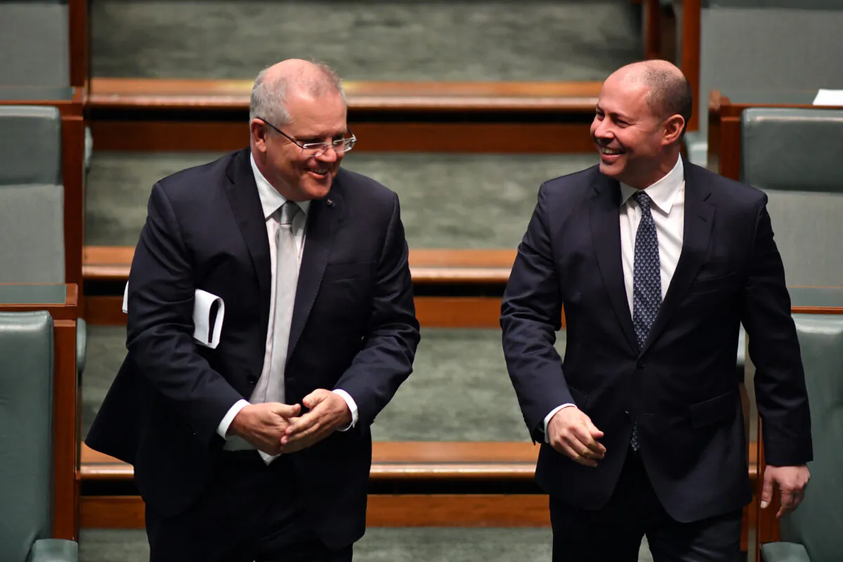 Prime Minister Scott Morrison and Treasurer Josh Frydenberg arrive in the House of Representatives at Parliament House in Canberra, Australia on May 13, 2020. (Sam Mooy/Getty Images)