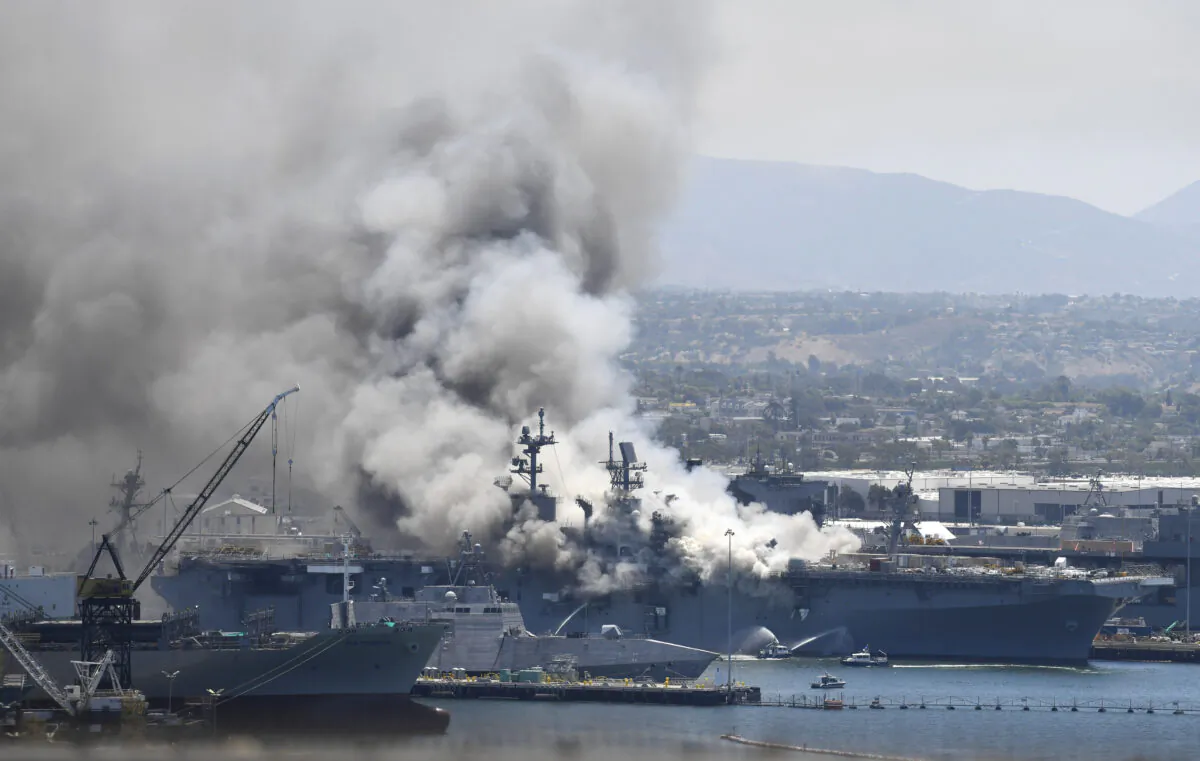 Smoke rises from the USS Bonhomme Richard at Naval Base San Diego, in San Diego, Calif., on July 12, 2020. (Denis Poroy/AP)