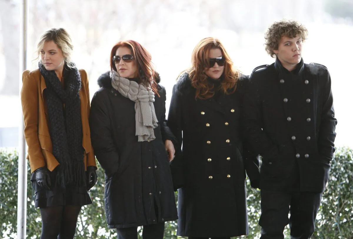 Priscilla Presley, second from left, her daughter, Lisa Marie Presley, second from right, and Lisa Marie's children, Riley Keough, left, and Benjamin Keough, right, take part in a ceremony in Memphis, Tenn., on Jan. 8, 2010. (Mark Humphrey/AP Photo)