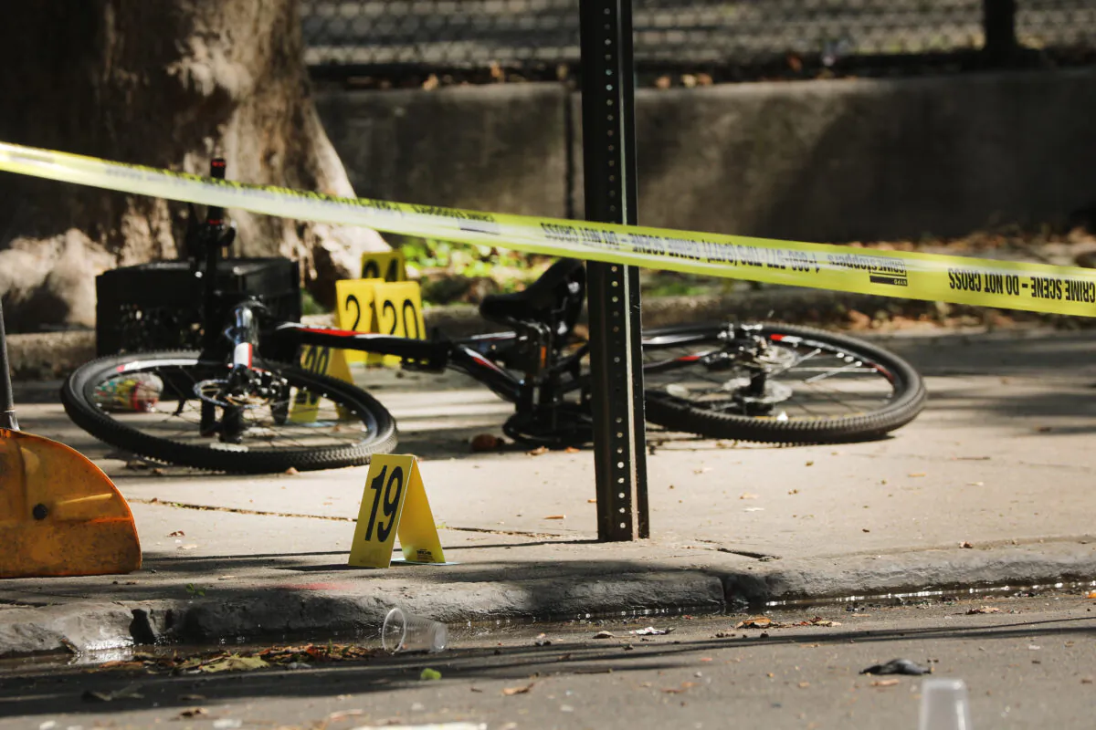 Police ballistic markers stand beside a child's bicycle at a crime scene where a 1-year-old child was shot and killed in New York City, on July 13, 2020. (Spencer Platt/Getty Images)