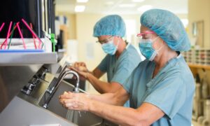 Amid Surge, Hospitals Hesitate to Cancel Nonemergency Surgeries