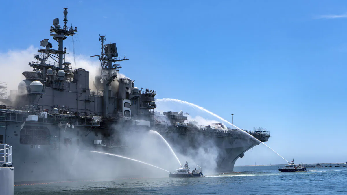 Port of San Diego Harbor Police Department boats combat a fire onboard the USS Bonhomme Richard (LHD 6) at Naval Base San Diego, on July 12, 2020. (Navy photo by Mass Communication Specialist 3rd Class Christina Ross)