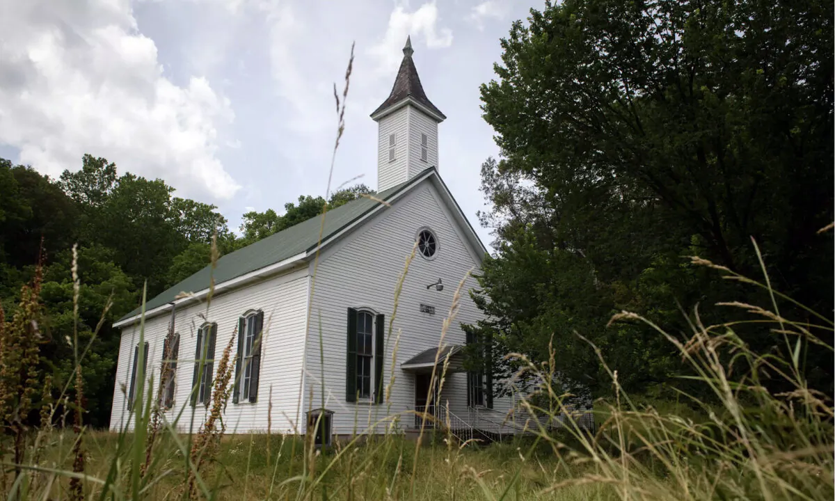 Five years after shutting its doors for good, the Enon Baptist Church stands on the precipice of either returning to the soil or finding an enterprising buyer to plunk down $50,000 and bring it back to a new life. (Justin Merriman)