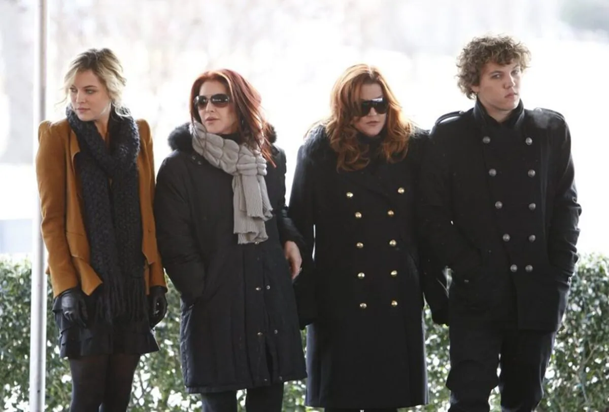 Priscilla Presley, second from left, her daughter, Lisa Marie Presley, second from right, and Lisa Marie's children, Riley Keough, left, and Benjamin Keough, right, take part in a ceremony commemorating Elvis Presley's 75th birthday in Memphis, Tenn., on Jan. 8, 2010. (Mark Humphrey/AP Photo)
