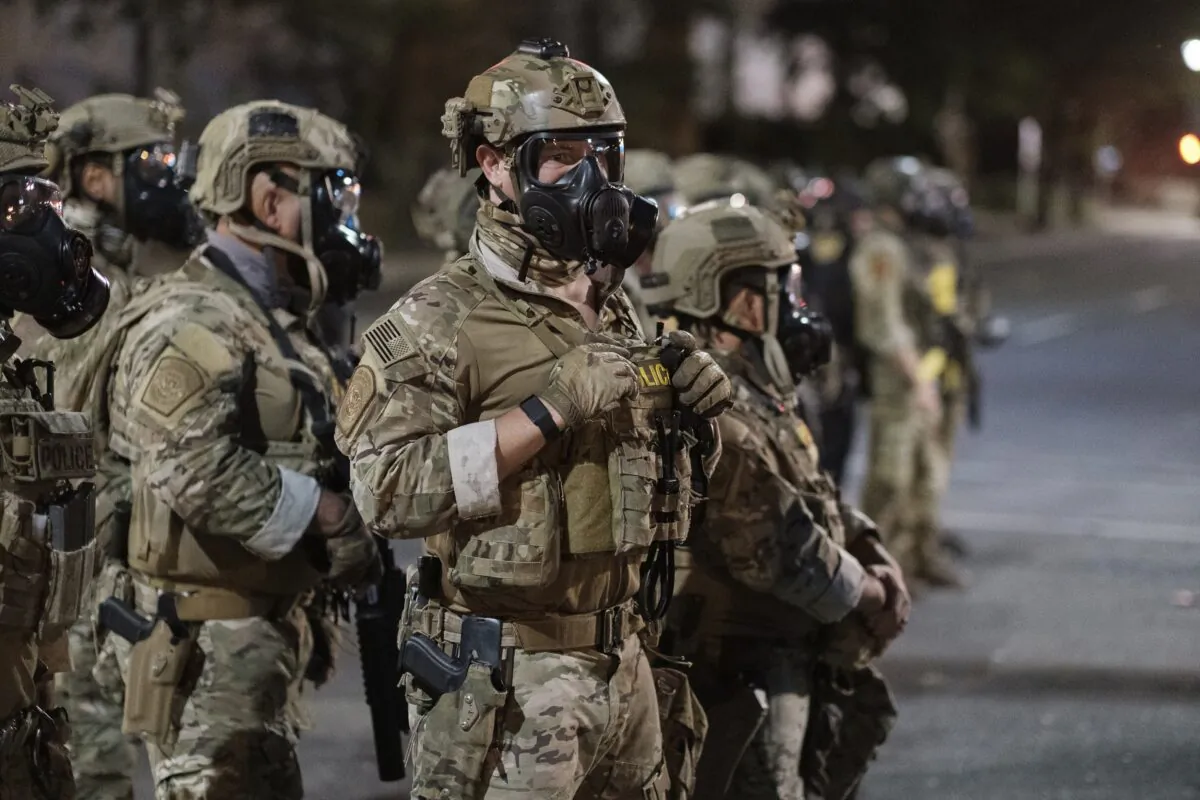 Agents from different components of the Department of Homeland Security are deployed to protect a federal courthouse in Portland, Ore., on July 5, 2020. (Doug Brown via AP)