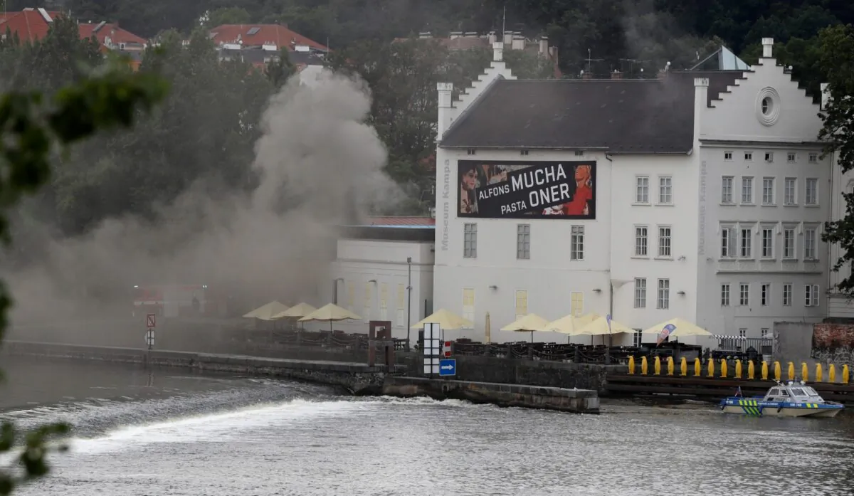 Smokes rises from a technical building of the Kampa Museum in Prague, Czech Republic, on July 15, 2020.(Petr David Josek/AP Photo)