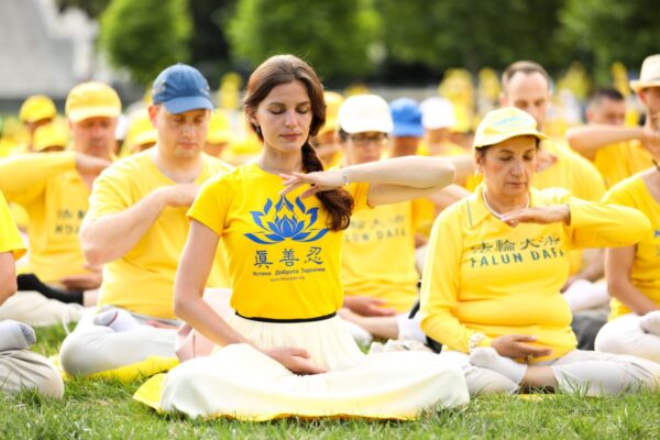 Falun Gong practitioners meditate