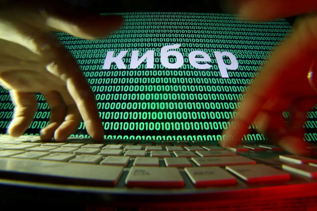 Hands are seen on a keyboard in front of a displayed cyber code in this picture illustration taken Oct. 4, 2018. (Dado Ruvic/Illustration/Reuters)