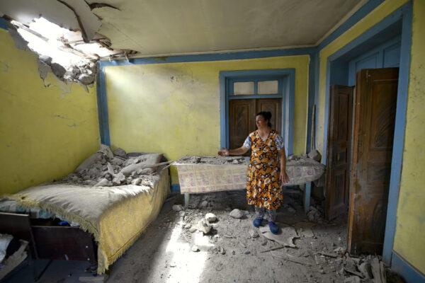 A local woman shows damage in her house-1