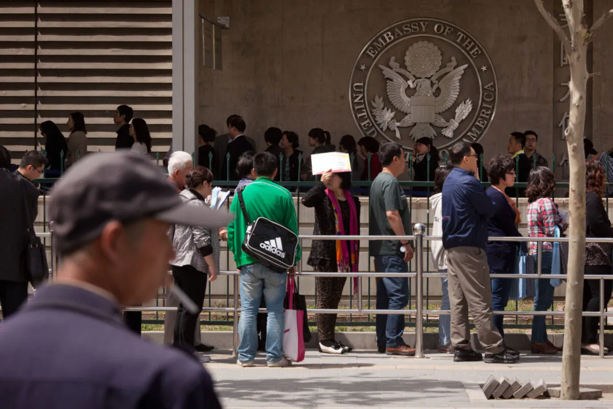 Chinese citizens wait in line to submit their visa applications at the U.S. Embassy in Beijing, China, on April 27, 2012. (Ed Jones/AFP/GettyImages)