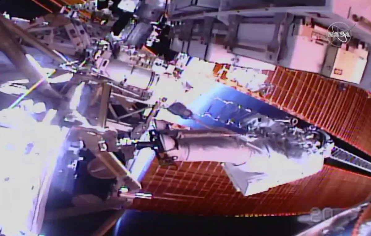 In this image taken from NASA video, NASA astronaut Chris Cassidy works outside the International Space Station on July 16, 2020. (NASA via AP)