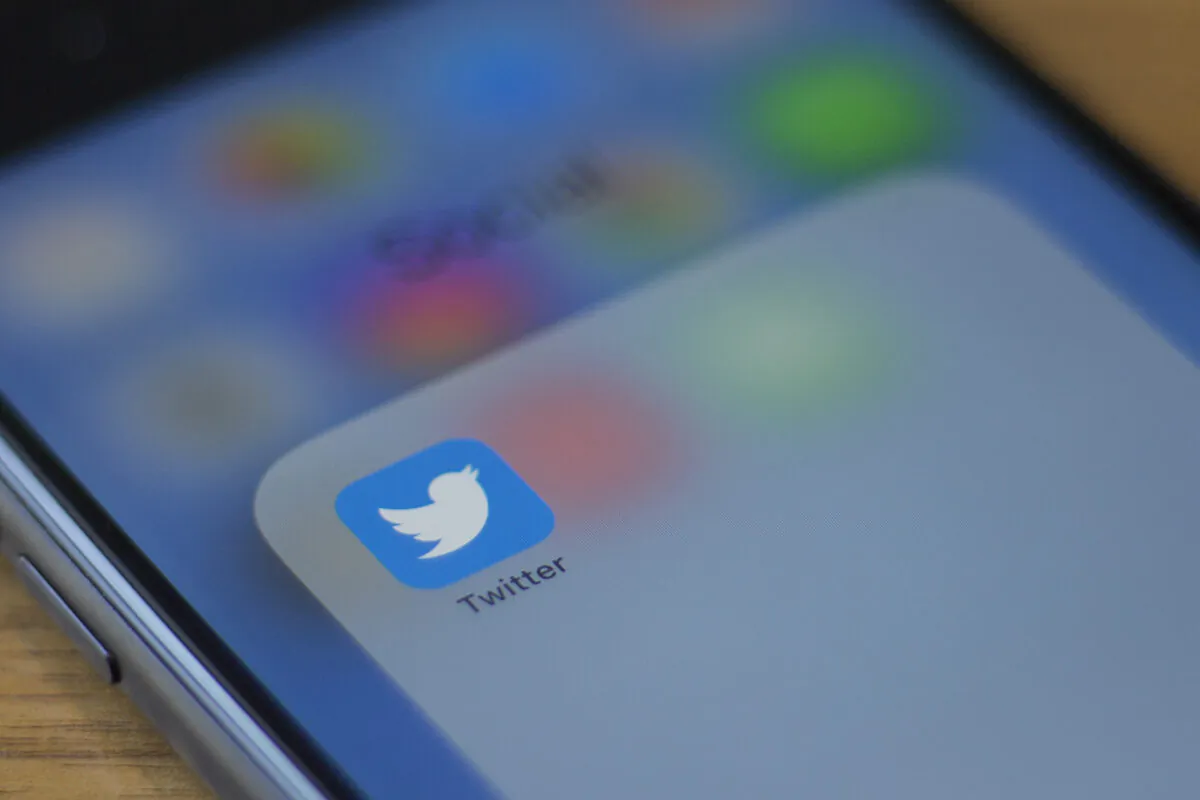 The Twitter logo on a phone in a photo illustration in Washington on July 10, 2019. (ALASTAIR PIKE/AFP via Getty Images)