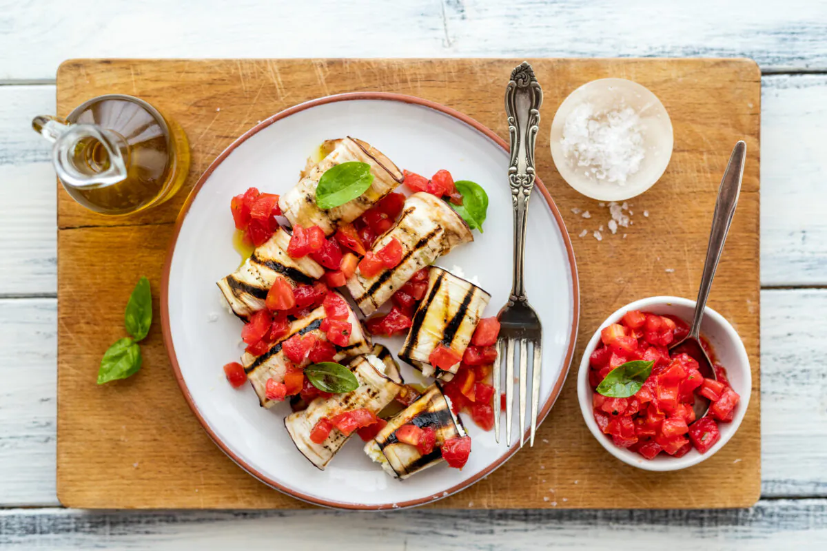 For this quintessential Mediterranean appetizer, stuff grilled eggplant slices with herby ricotta and dress them with fresh tomatoes. (Photo by Giulia Scarpaleggia)