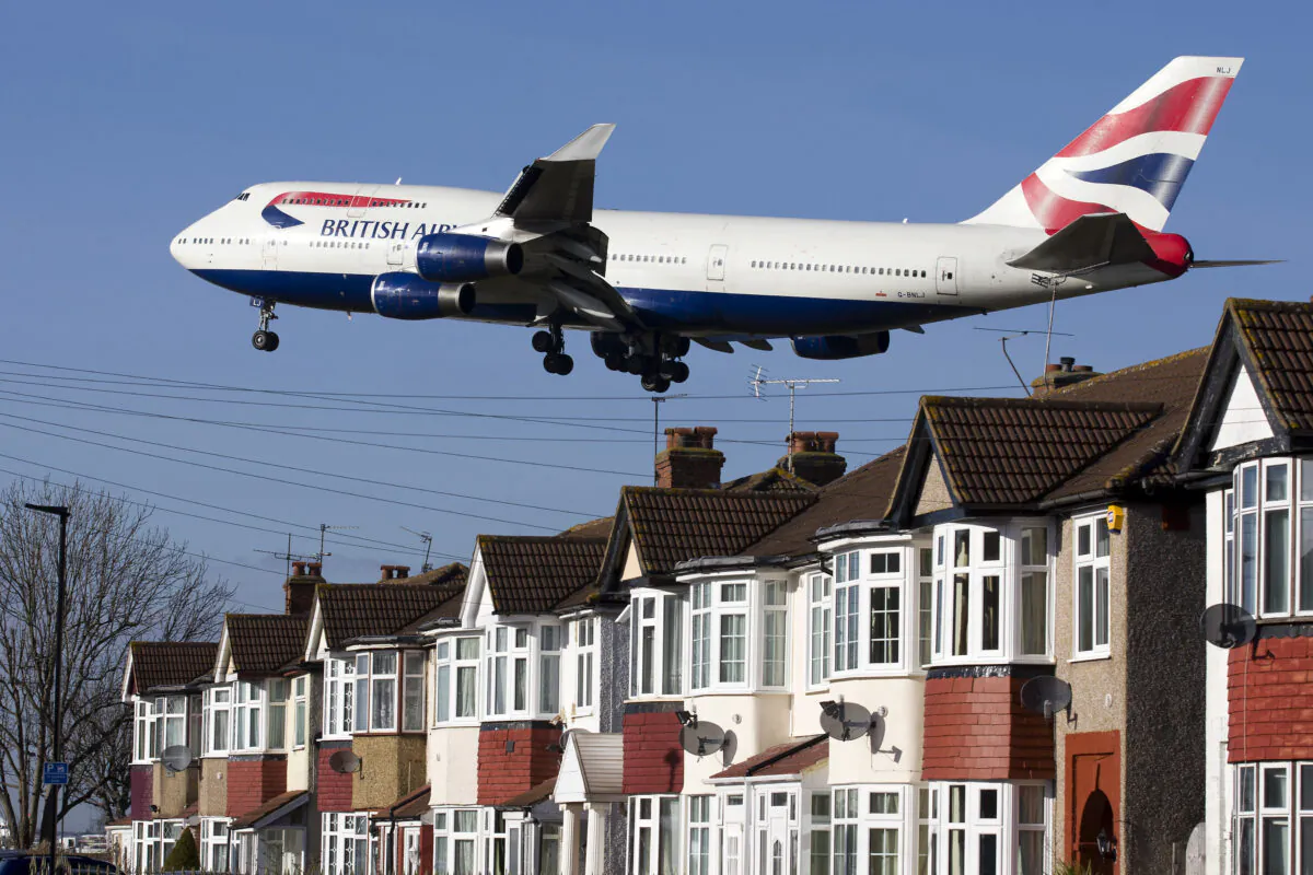 A British Airways 747 aircraft flies over roof tops as it comes into lane at Heathrow Airport in west London on Feb. 18, 2015. (Justin Tallis/AFP via Getty Images)