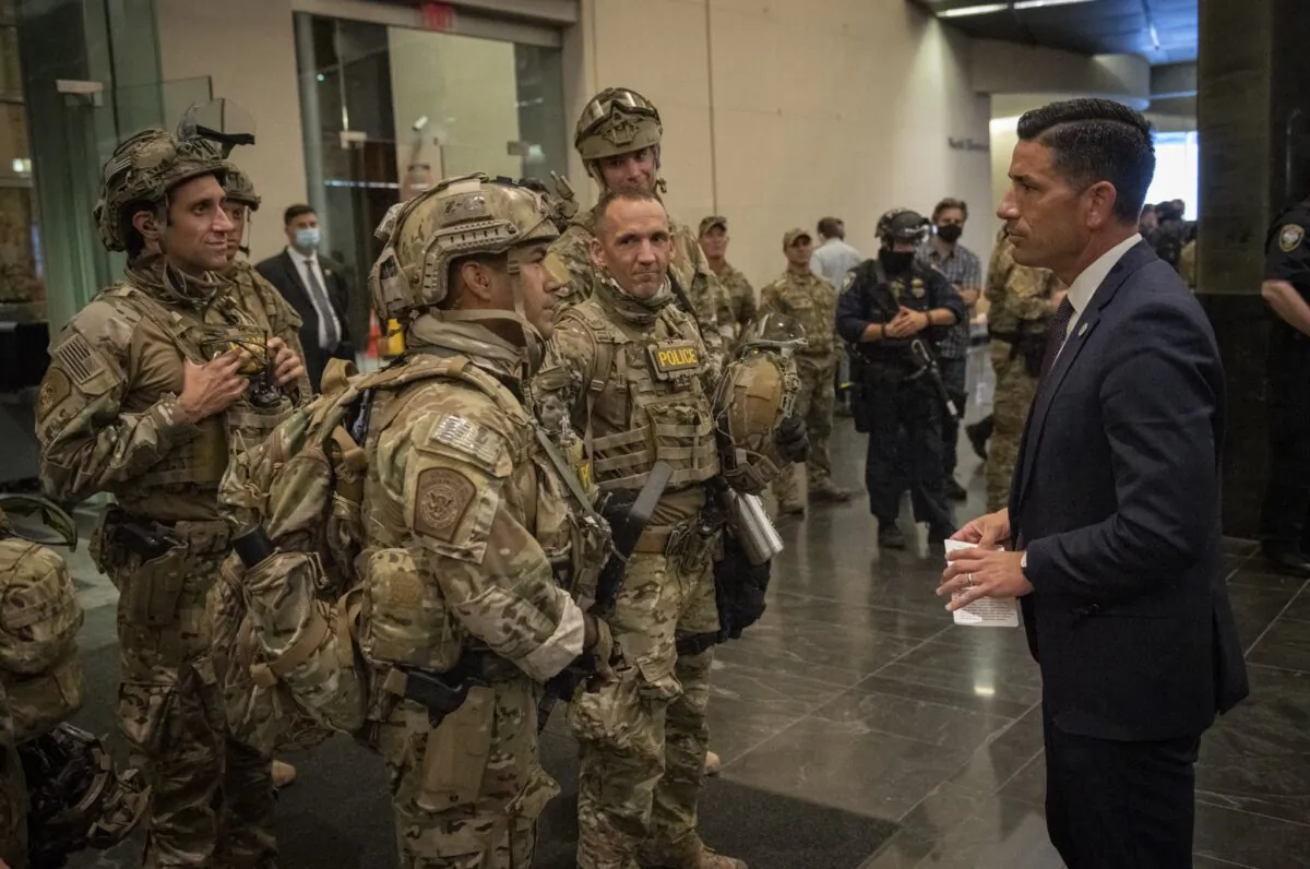 Acting Department of Homeland Security Secretary Chad Wolf meets with federal officers in Portland in an undated photograph released July 17, 2020. (Department of Homeland Security)