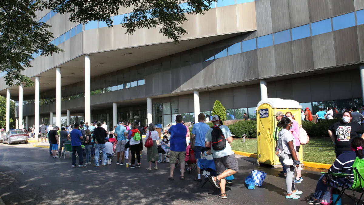 Hundreds of unemployed Kentucky residents wait in long lines outside the Kentucky Career Center for help with their unemployment claims in Frankfort, Ky., on June 19, 2020 (John Sommers II/Getty Images)