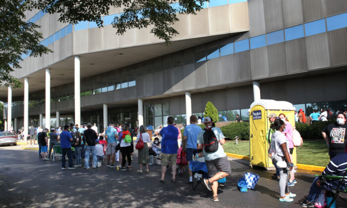 Hundreds of unemployed Kentucky residents wait in long lines outside the Kentucky Career Center for help with their unemployment claims in Frankfort, Ky., on June 19, 2020 (John Sommers II/Getty Images)
