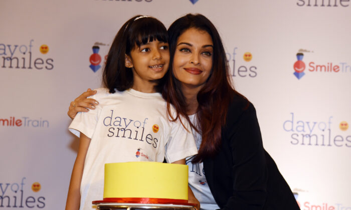 Indian Bollywood actress Aishwarya Rai Bachchan (R) poses with her daughter Aaradhya Bachchan during a birthday event with NGO Smile Train India in honour of her late father, Krishnaraj Rai, in Mumbai on Nov. 20, 2018. (-/AFP via Getty Images)