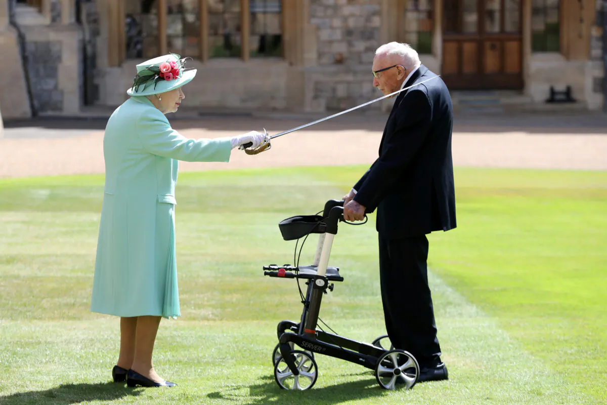 Britain's Queen Elizabeth awards Captain Tom Moore with the insignia of Knight Bachelor at Windsor Castle, in Windsor, Britain, on July 17, 2020. (Chris Jackson/Pool via Reuters)