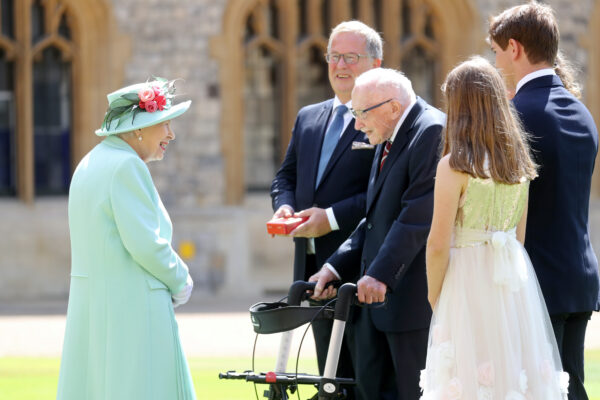 Britain's Queen Elizabeth talks to Captain Tom Moore and his family