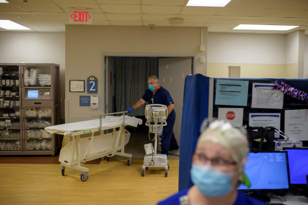 A health care worker in a file photo. (Mark Felix/AFP /AFP via Getty Images)