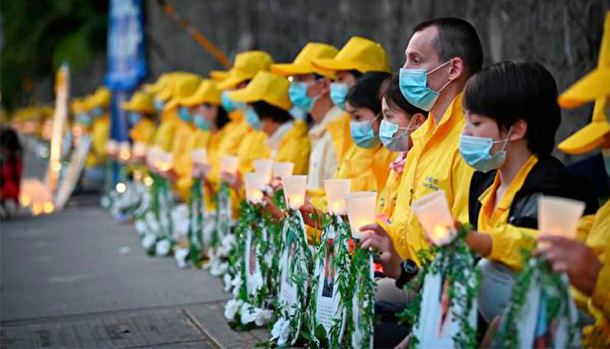 Falun Gong adherents held a candlelight vigil in front of the Chinese Consulate in Vancouver to highlight the persecution of their faith in China on July 10, 2020. (Courtesy of Minghui.org)