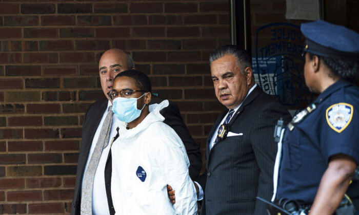 Tyrese Devon Haspil, 21, is walked out of NYPD 7th precinct after been charged with second-degree murder in the death of the 33-year-old tech CEO Fahim Saleh, in New York, on July 17, 2020. (AP Photo/Eduardo Munoz Alvarez)