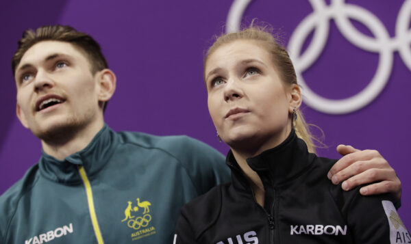Ekaterina Alexandrovskaya and Harley Windsor of Australia watch as their scores