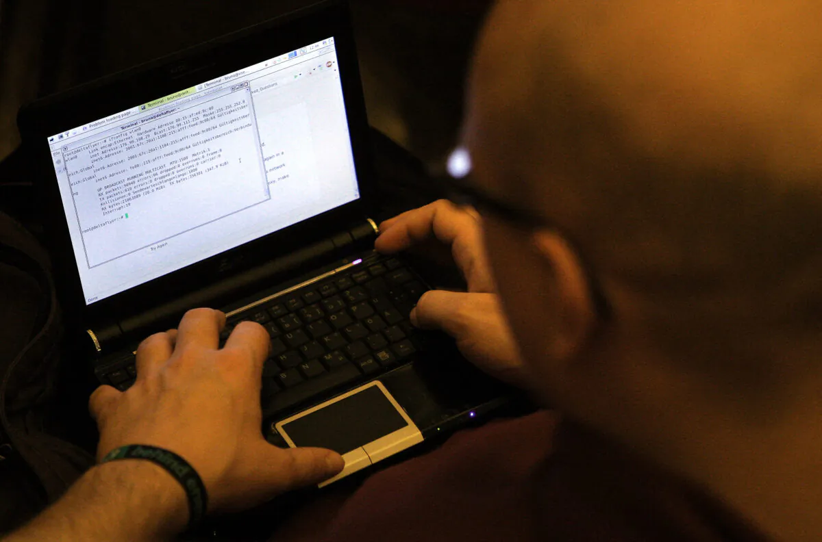 A man at the computer on Dec. 27, 2011. (Adam Berry/Getty Images)