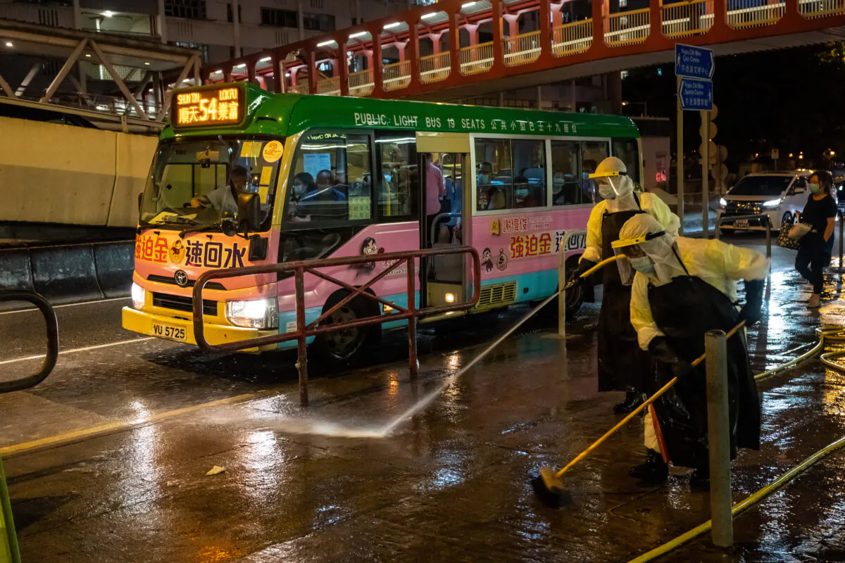 Food and Environmental Hygiene Department (FEHD) contractors take part in a cleaning and disinfection of Ngau Chi Wan Market in Choi Hung district, Hong Kong, China, 17 July 2020. (Billy H.C. Kwok/Getty Images)