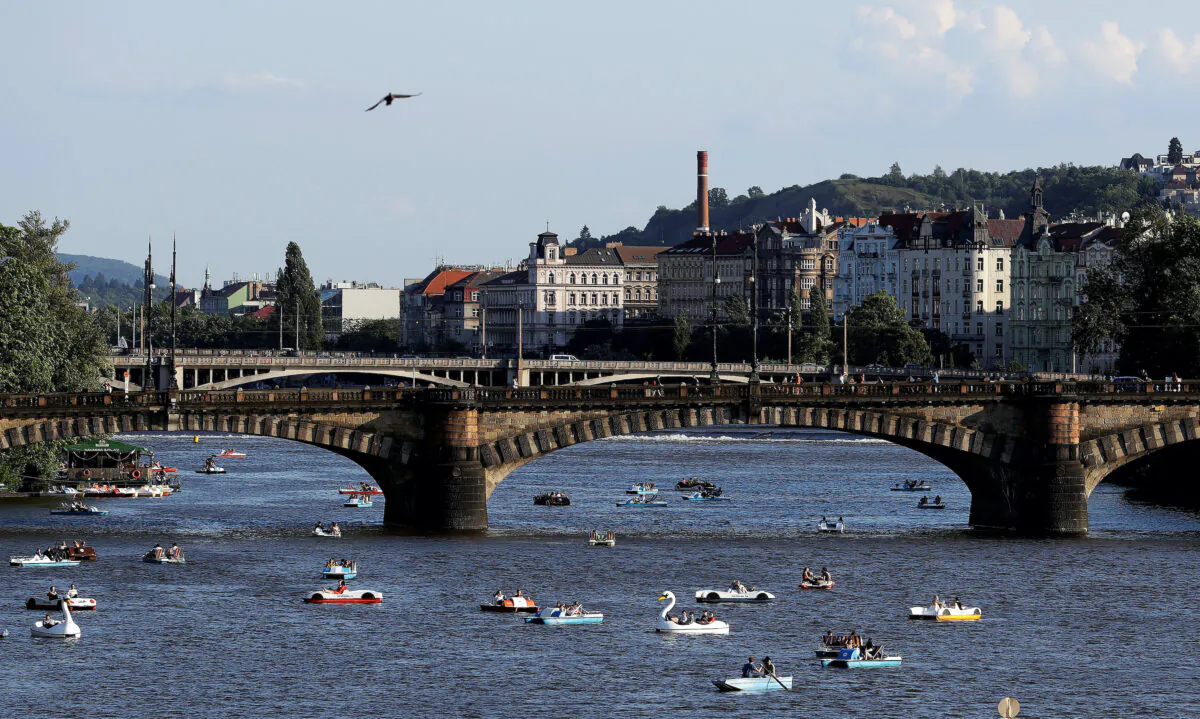 People ride pedal boats on the Vltava River following the coronavirus disease (COVID-19) outbreak, in Prague, Czech Republic, on June 22, 2020. (David W Cerny/Reuters)