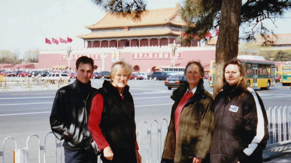 (L-R) Stuart Martin, Jan Becker, Rivati, Denice Johnson posing for a photo in front of Tiananmen Square on March 7, 2002. (Courtesy of Denice Johnson)