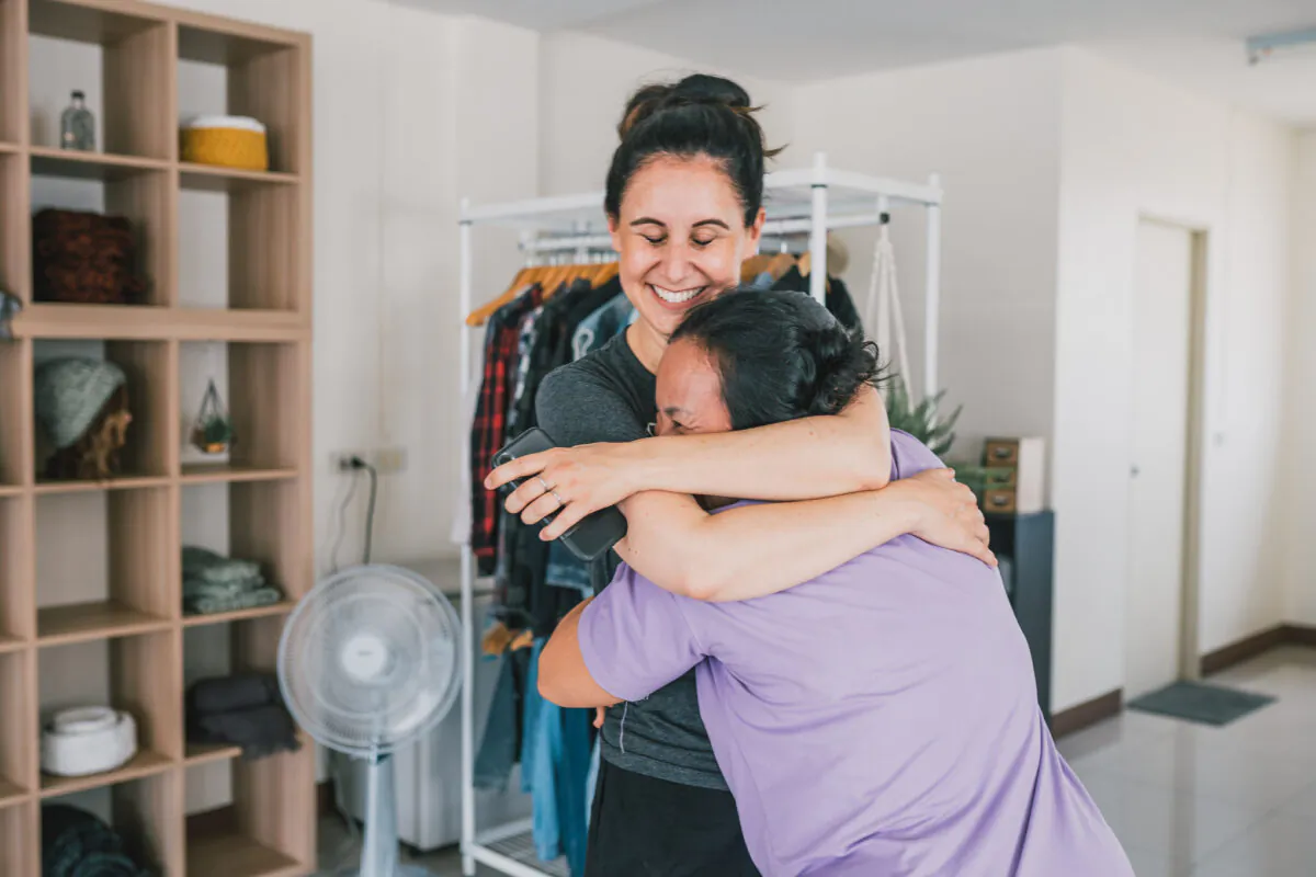 Dianna Bautista hugs a participant in her Shear Love program, which teaches former sex workers to become hairstylists. (Courtesy of Dianna Bautista)