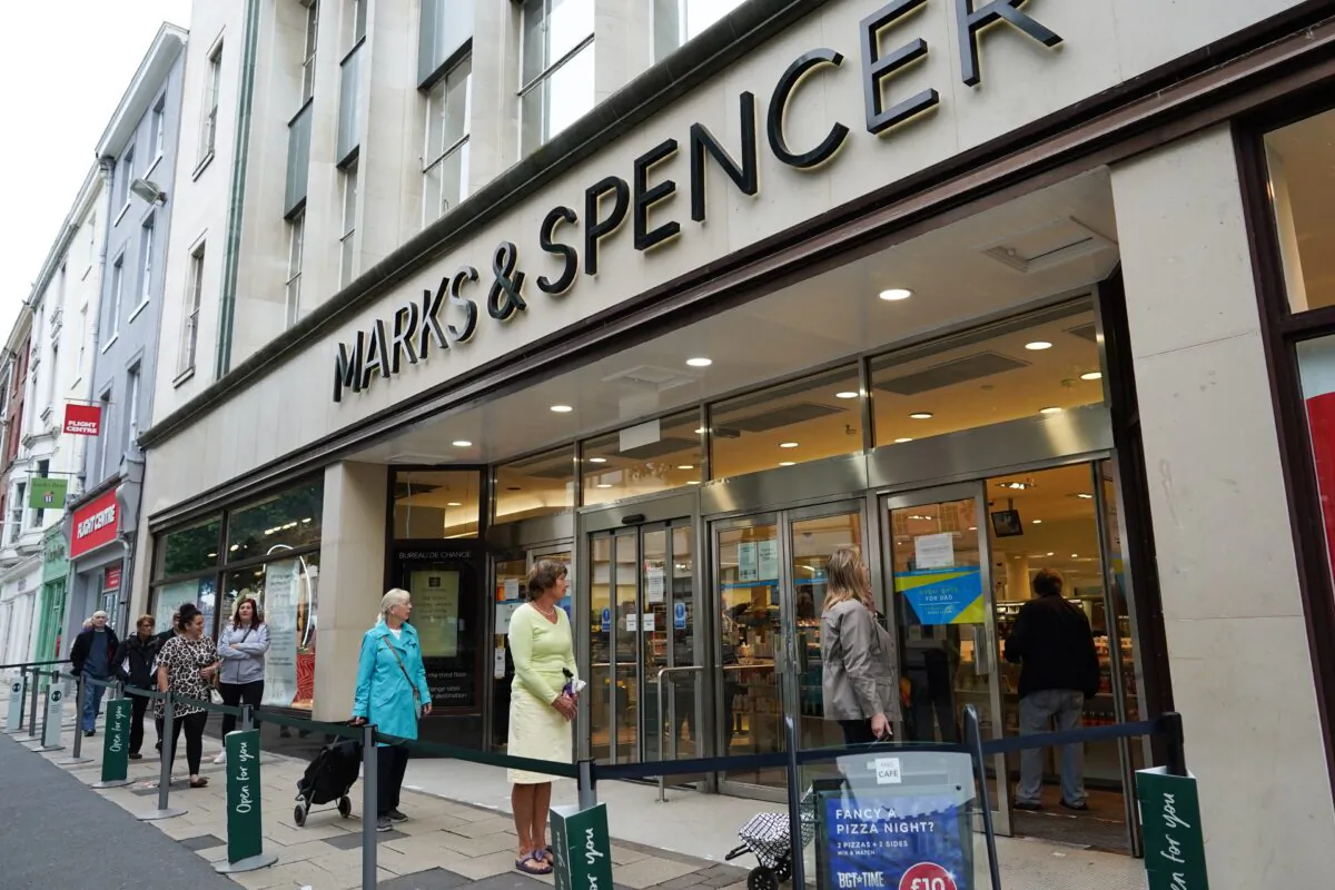 Customers queue to enter Marks & Spencer, who have announced job losses during the CCP virus lockdown, in York, United Kingdom, on June 15, 2020. (Ian Forsyth/Getty Images)