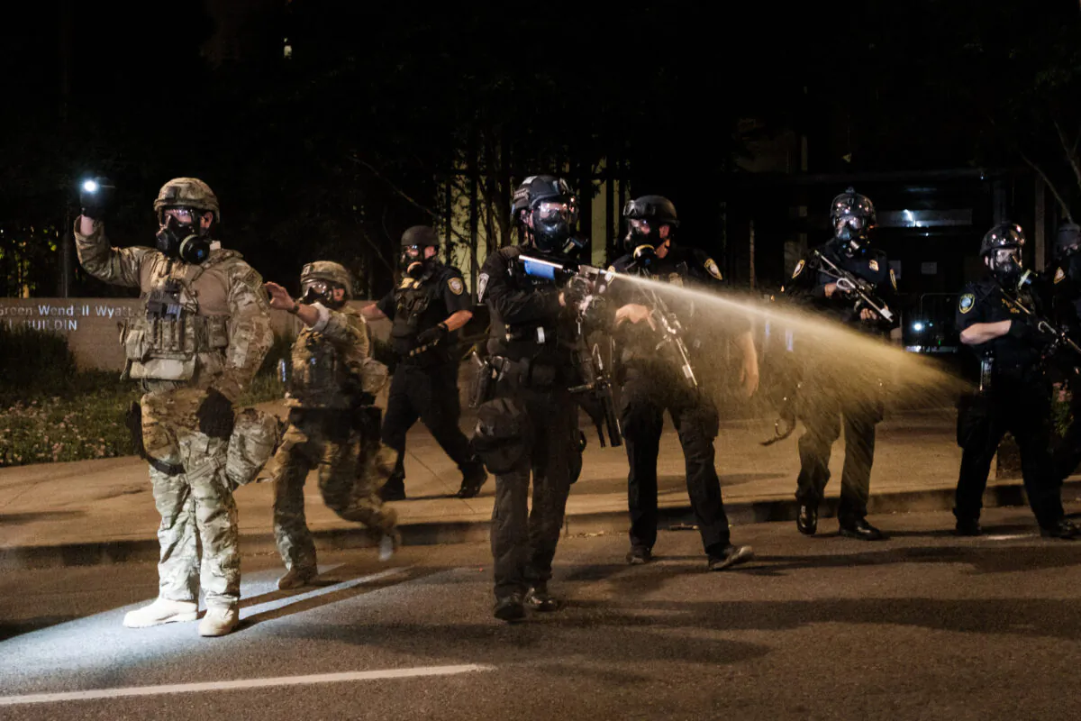 Federal officers respond to violent protests outside the Multnomah County Justice Center in Portland, Ore., on July 17, 2020. (Mason Trinca/Getty Images)