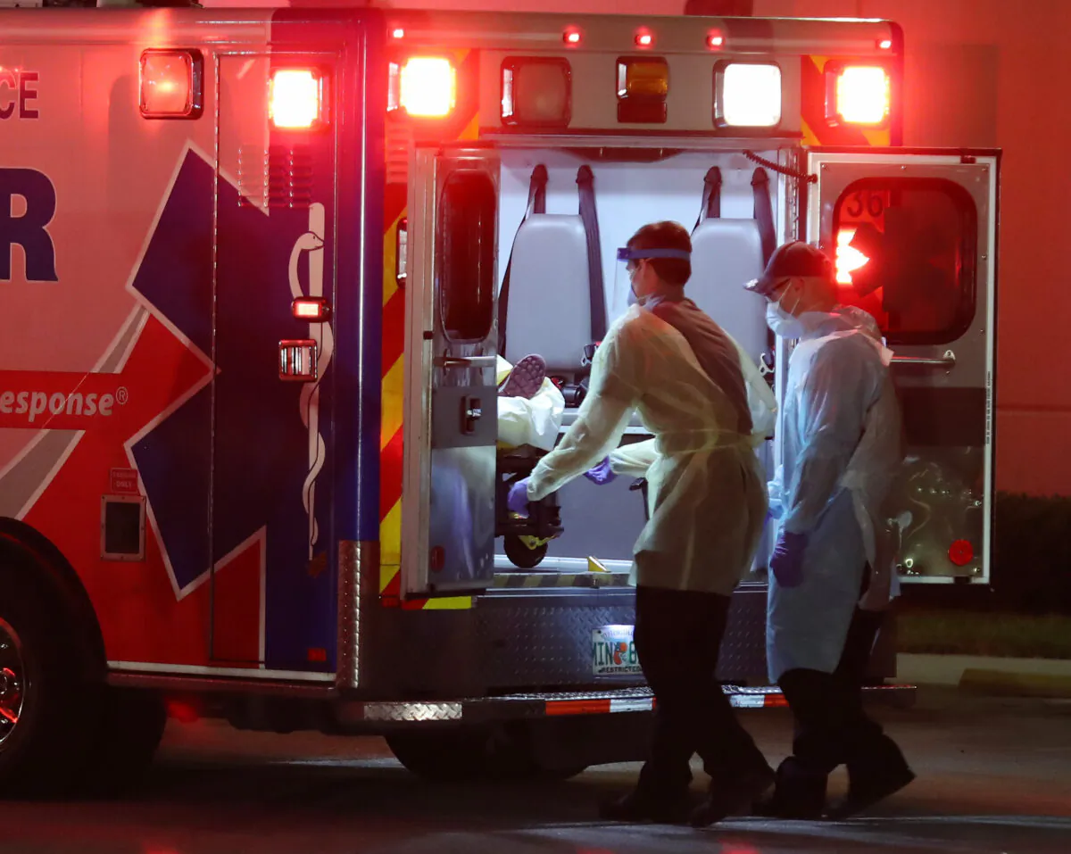 A patient is taken from an ambulance at the Broward Health Medical Center in Fort Lauderdale, Fla., on April 2, 2020. (Joe Raedle/Getty Images)