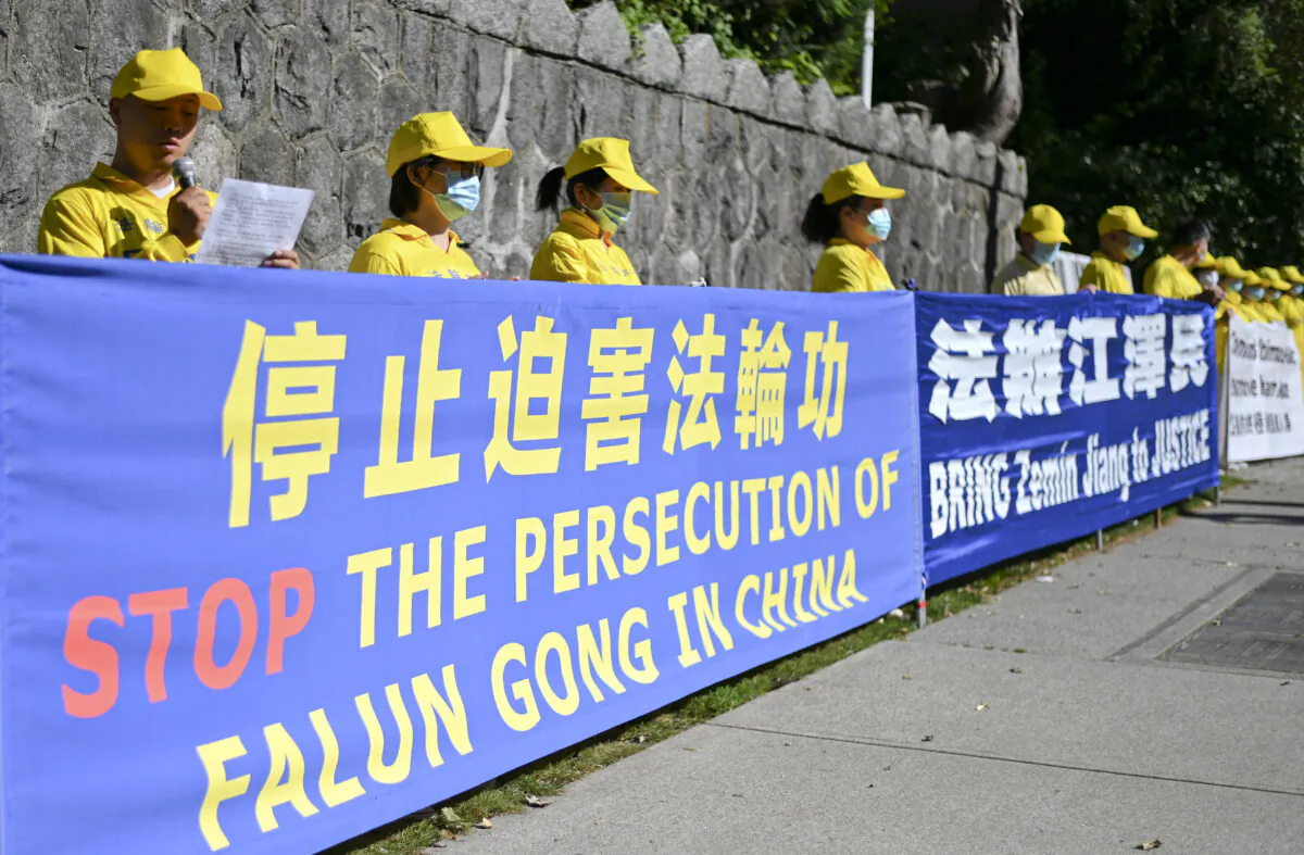 Falun Gong practitioners hold a rally to commemorate the 21st anniversary of the persecution of Falun Gong, in Vancouver, Canada, on July 19, 2020. (Da Yu/The Epoch Times)