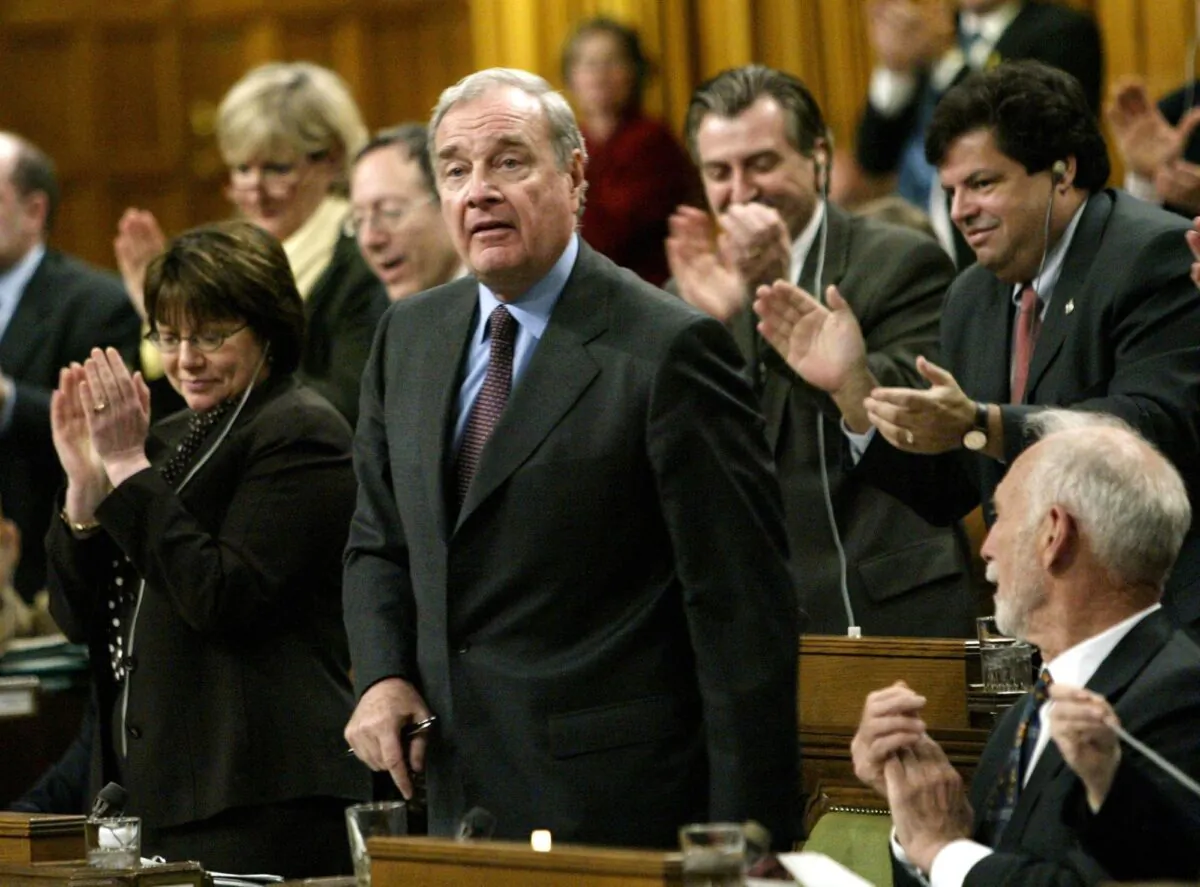 Prime Minister Paul Martin receives a standing ovation after responding to questions concerning the sponsorship scandal in the House of Commons on April 20, 2004. The scandal became a significant factor in the defeat of the Liberals in the 2006 federal election after more than 12 years in power. (CP Photo/Tom Hanson)

